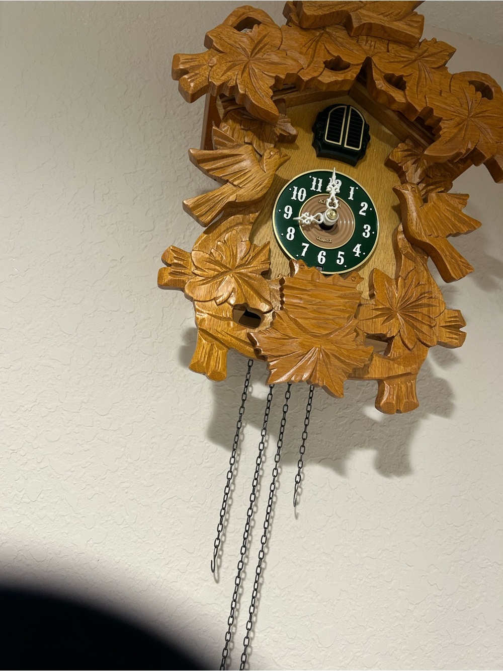 Carved Wooden Cuckoo Wall Clock with Green Dial
